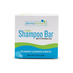 Dermaharmony shampoo bar held in hand showing compact 4 oz size