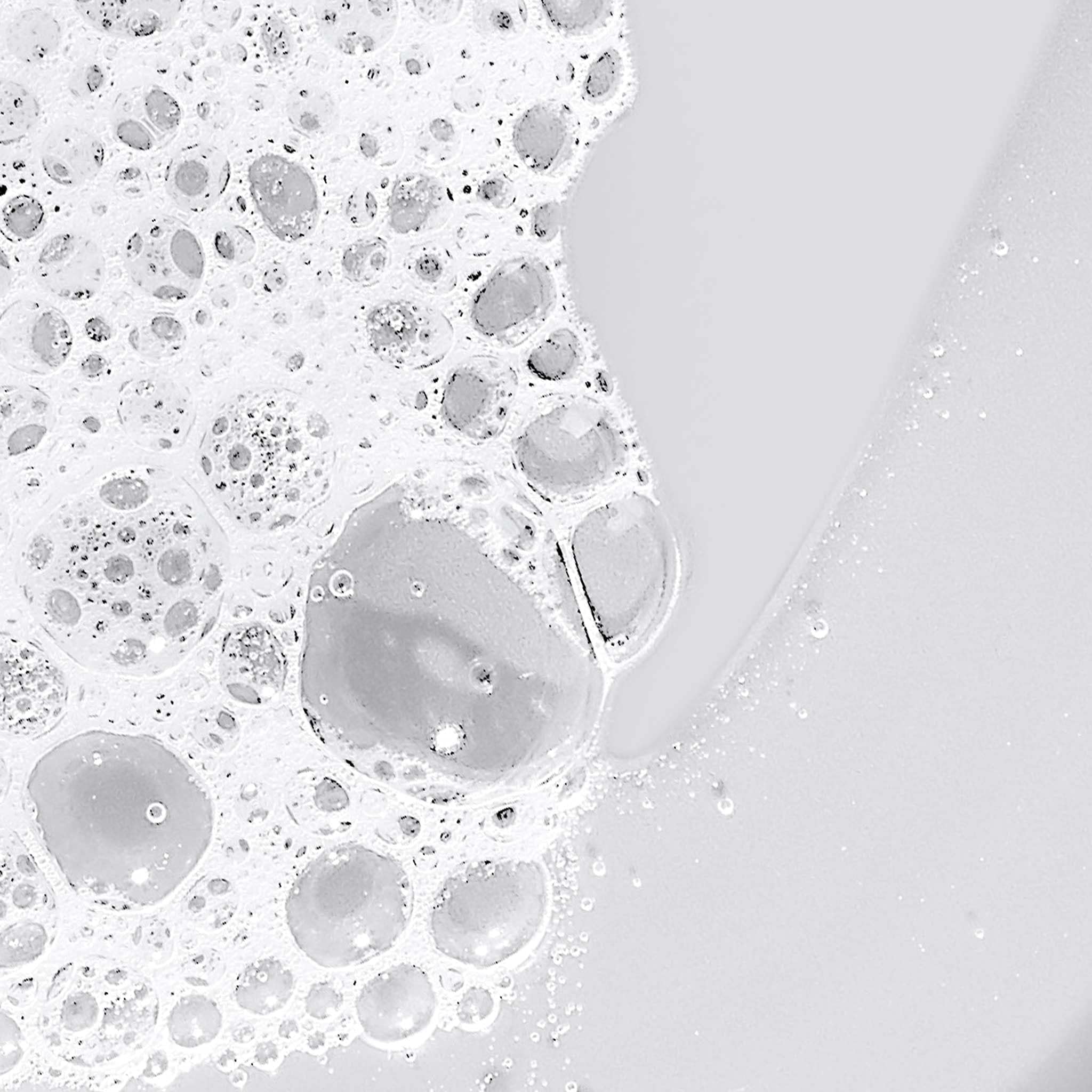 Dermalogica lather on hand in shower illustrating thorough, non‑drying cleanse