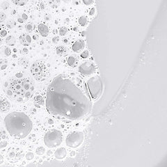 Dermalogica lather on hand in shower illustrating thorough, non‑drying cleanse