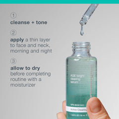 Dermalogica serum being applied to cheek in mirror for targeted blemish care