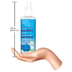 Desert Essence bottle held for scale to show 8 fl oz size and family-friendly volume