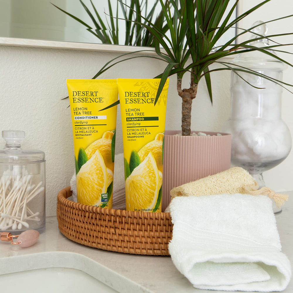 Desert Essence bottle styled on bathroom shelf suggesting clean, natural routine benefit