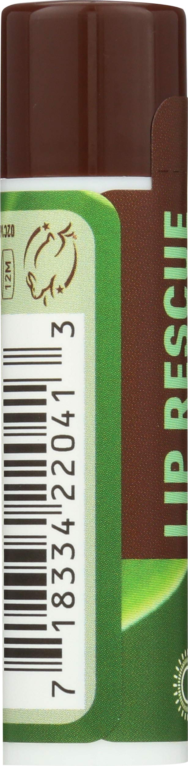 Desert Essence lip rescue shown in hand to illustrate compact travel size