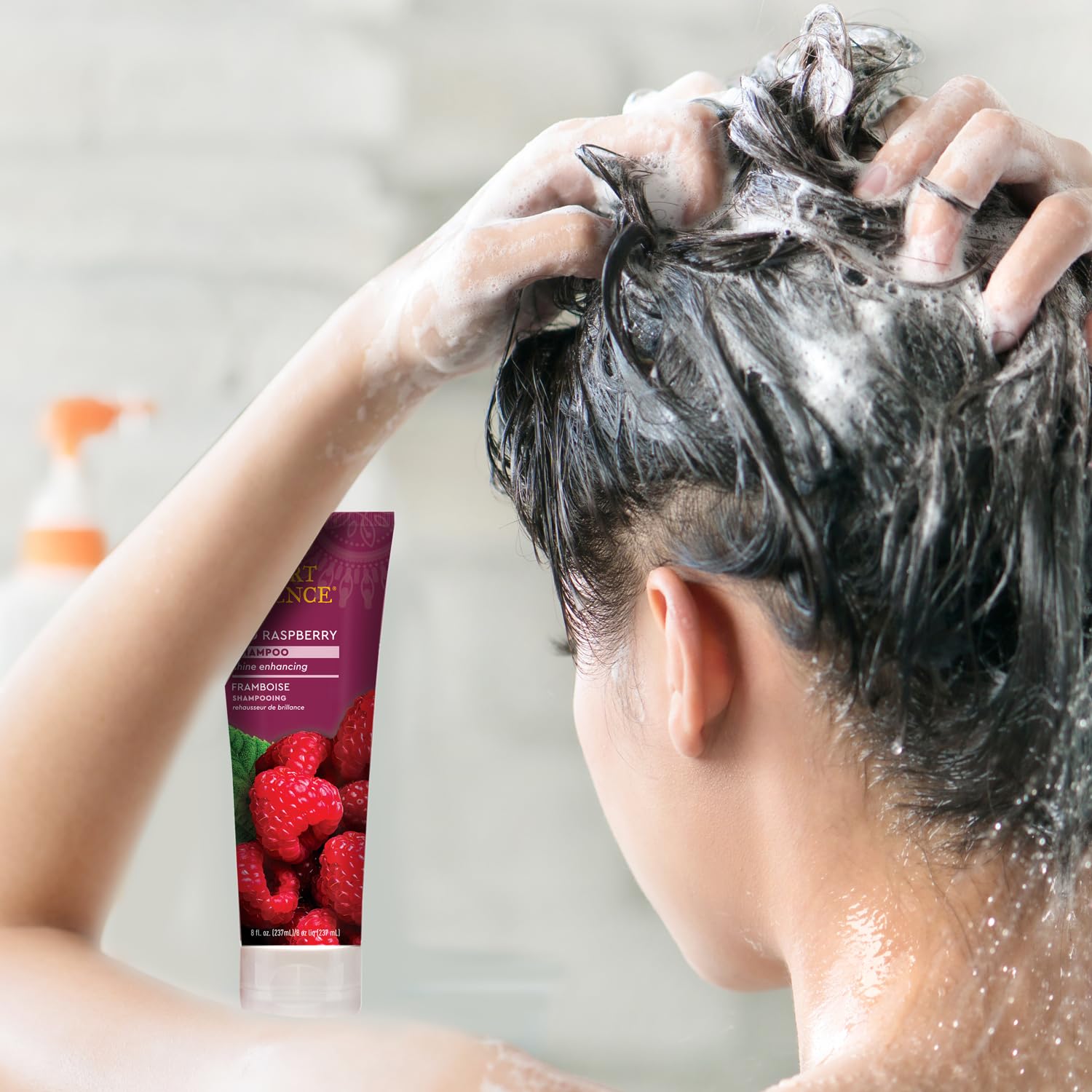Desert Essence shampoo on bathroom shelf suggesting daily routine compatibility