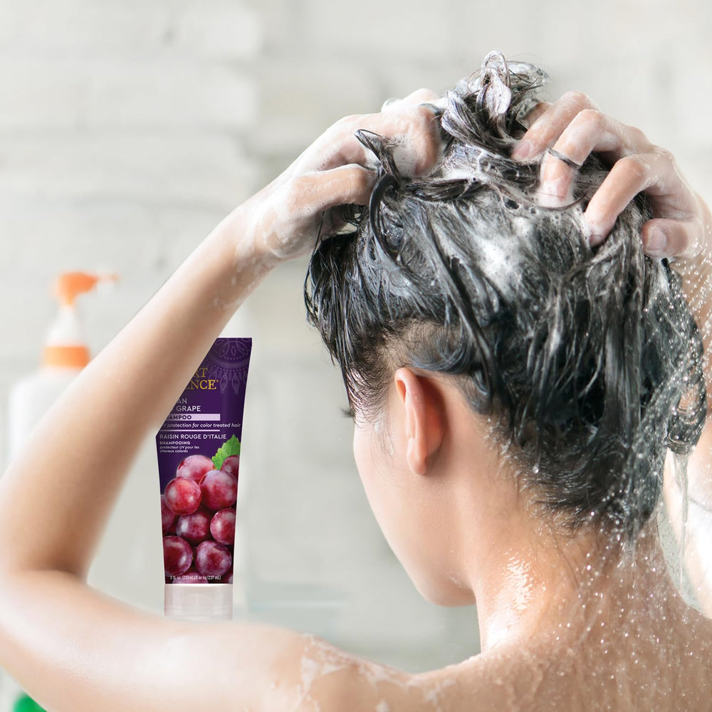 Desert Essence shampoo in use lathering hair to demonstrate gentle cleansing benefit