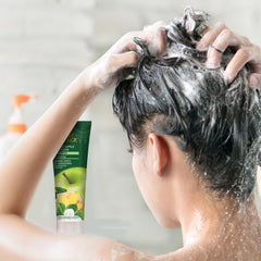 Desert Essence shampoo lather close-up demonstrating gentle foam and mild cleansing