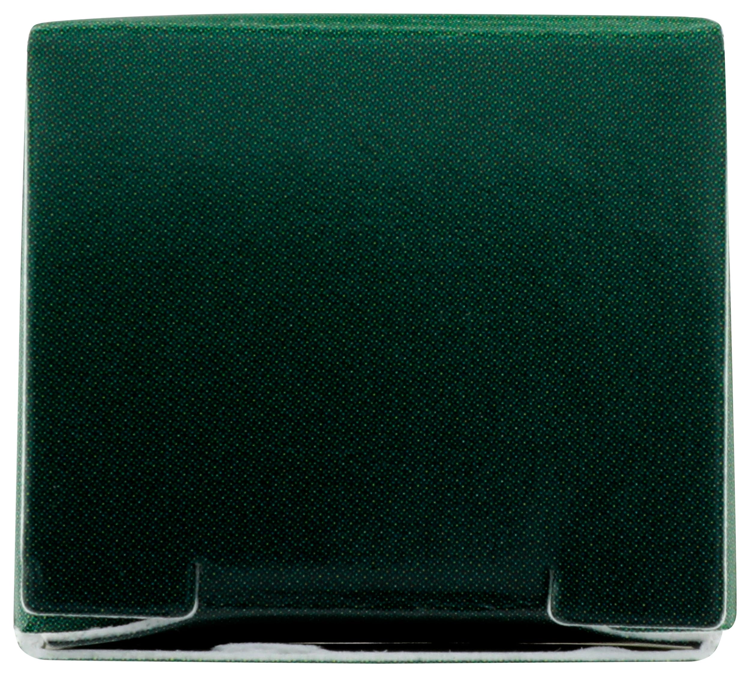 Desert Essence touch stick in a handbag near mirror for convenient on‑the‑go use