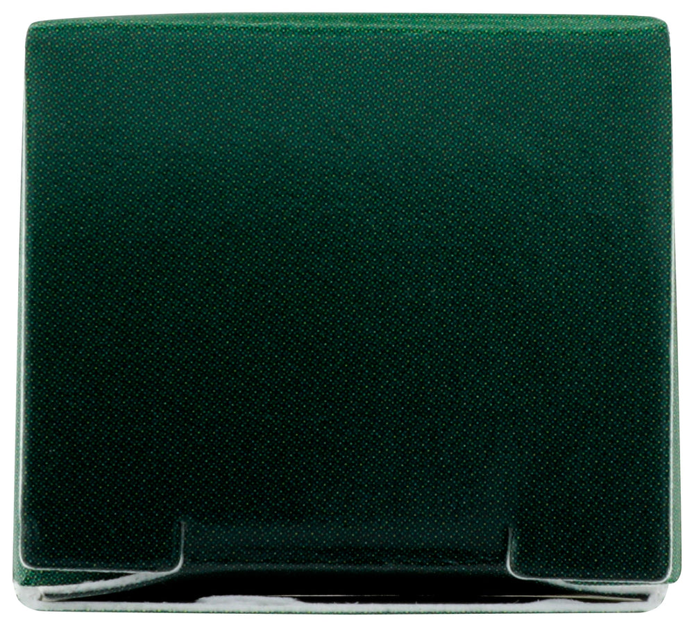 Desert Essence touch stick in a handbag near mirror for convenient on‑the‑go use