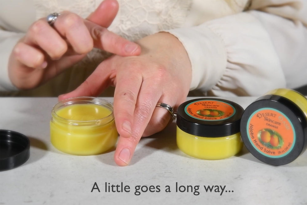 Desert Oasis beeswax and avocado oils laid out to show nourishing ingredient benefits