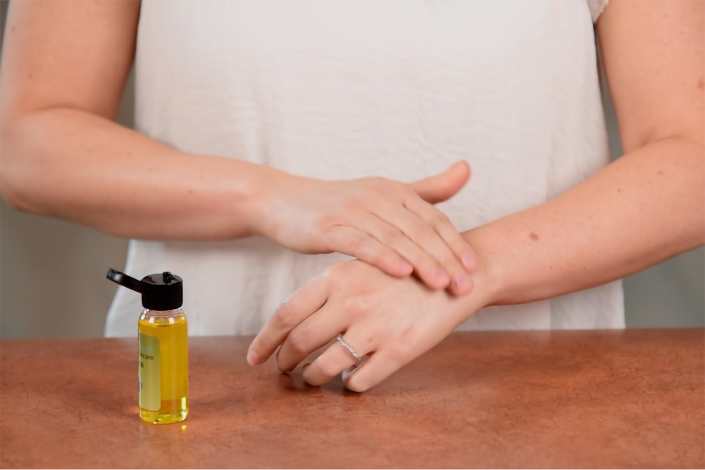Desert Oasis Skincare pouring jojoba oil texture showing lightweight finish
