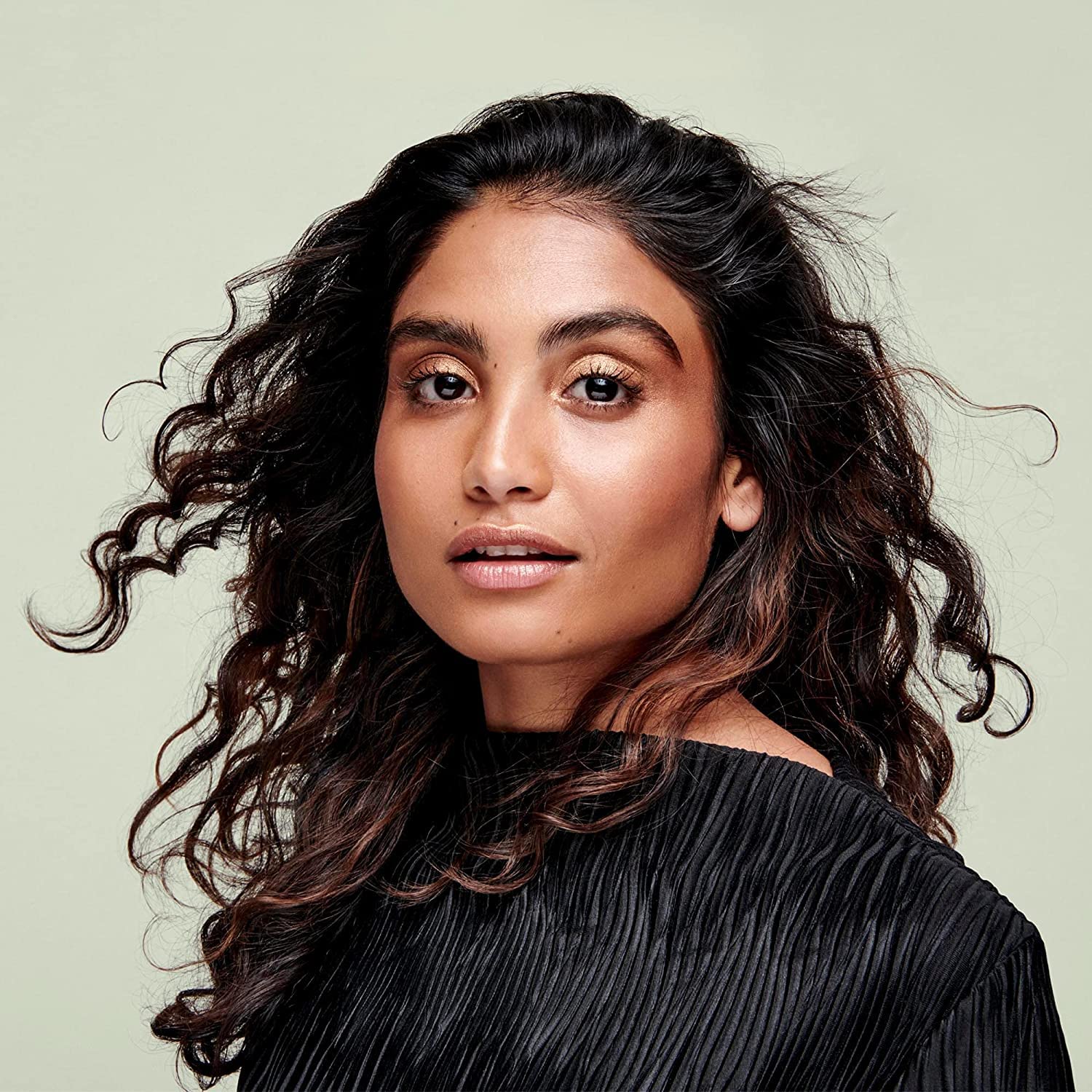 DevaCurl One Condition Decadence being applied to coarse curls for smoother detangling