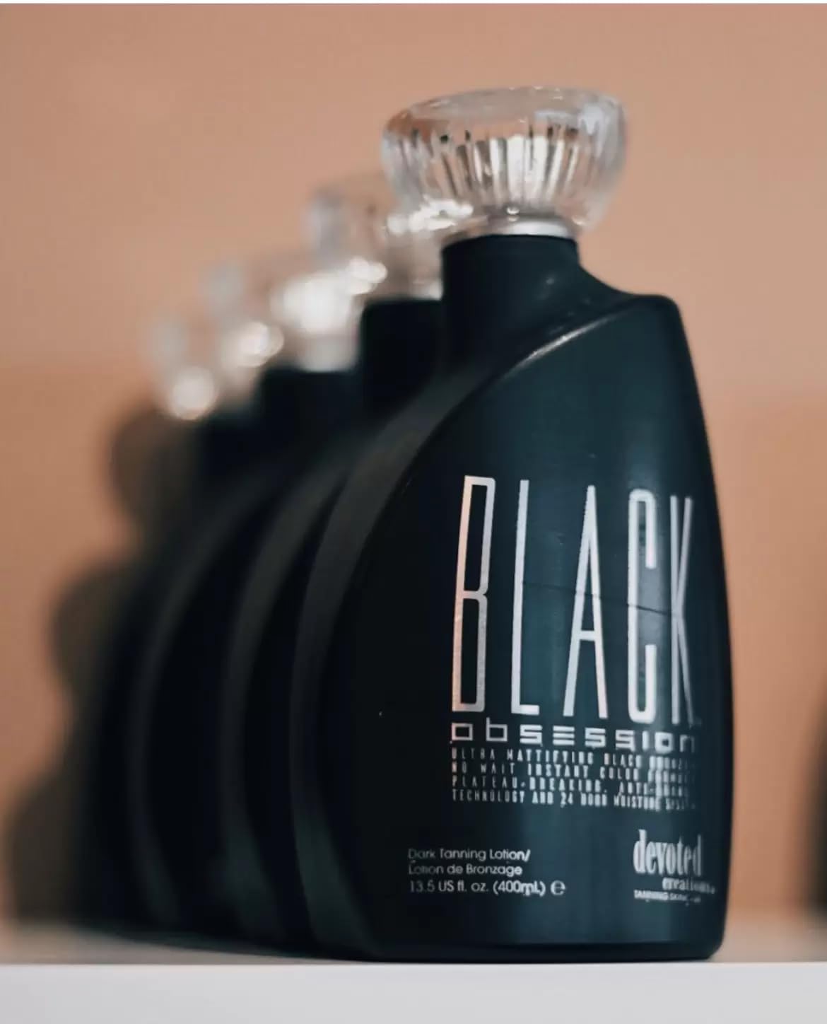Devoted Creations applied on forearm demonstrating instant black bronzing and even coverage