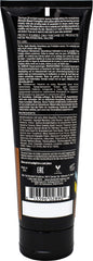 Devoted Creations lotion texture poured on hand highlighting argan-enriched moisturizing feel