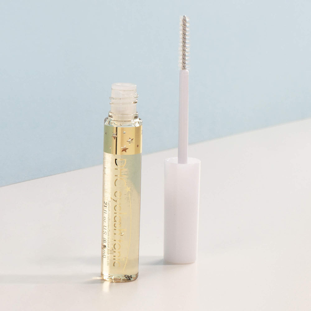 DHC Eyelash Tonic being applied to lashes to reduce breakage and improve resilience