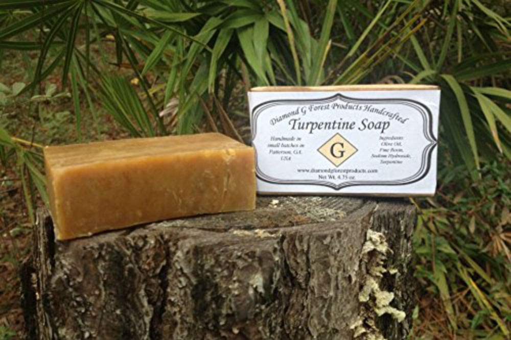 Diamond G turpentine soap in hunter's hands outdoors showing cover-scent use benefit