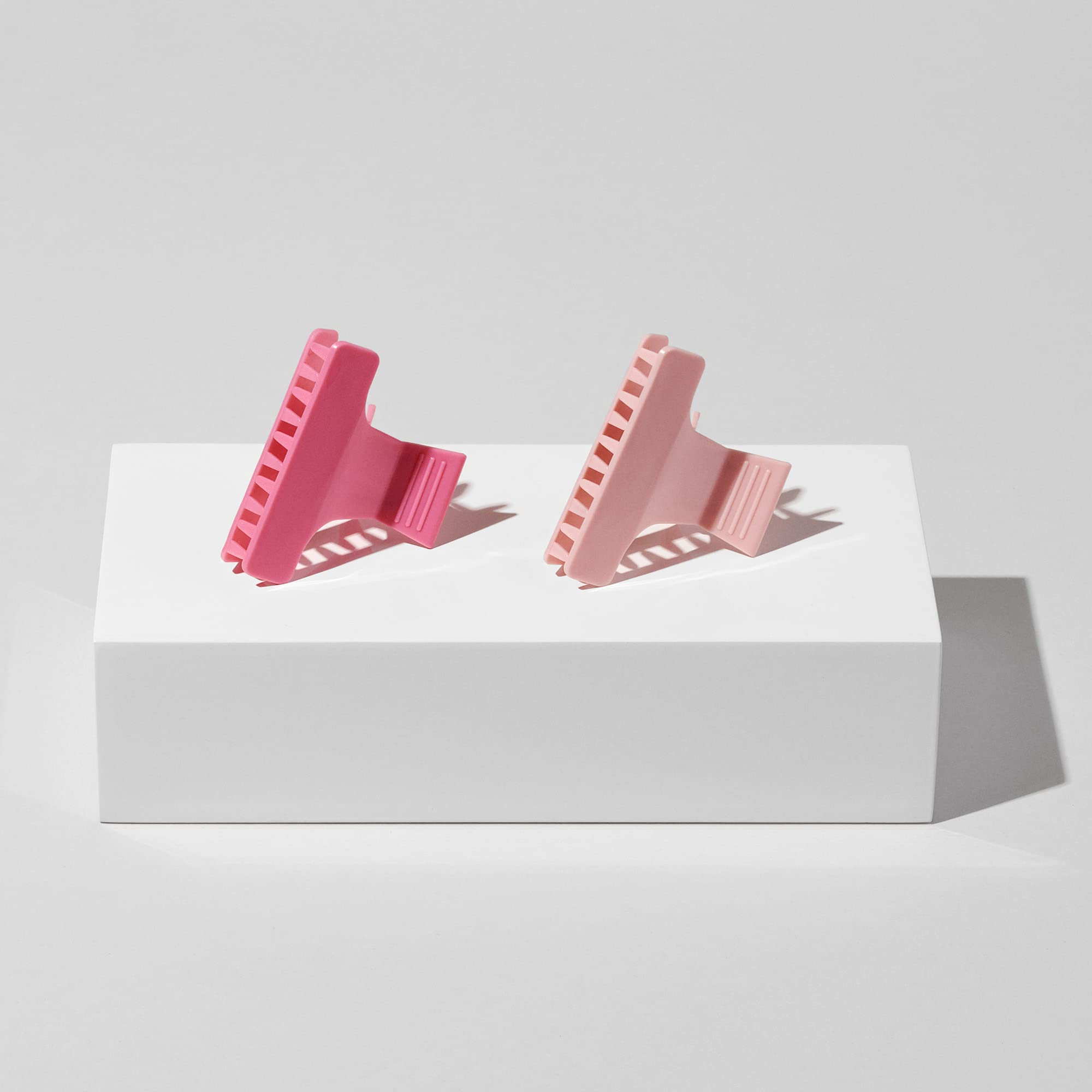 Diane clip next to ruler showing 2.25-inch size for scale and travel-friendly benefit