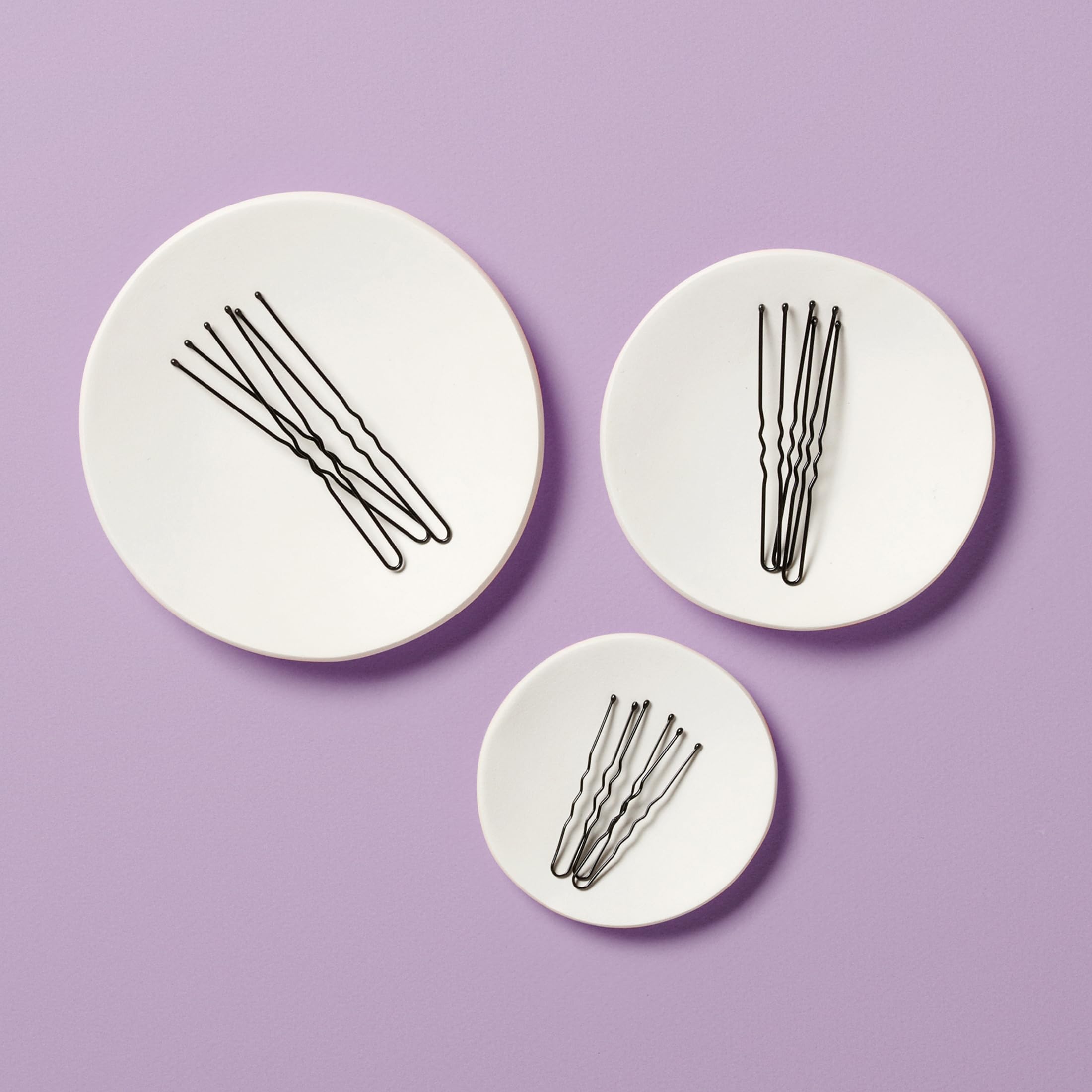 Diane hair pins securing a bun updo for event-ready hold