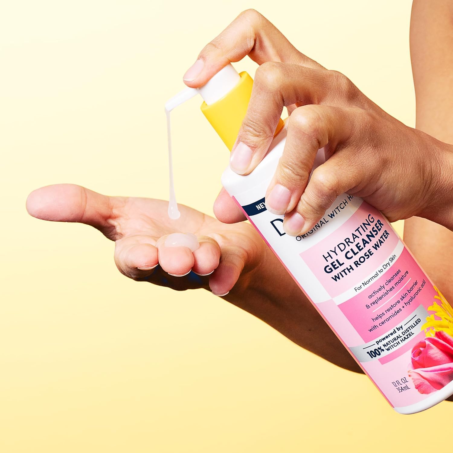 Dickinson's 12 oz bottle next to a hand to show real size