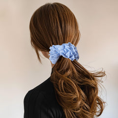 Dimeho scrunchie held in hand to show true oversized 18 cm scale