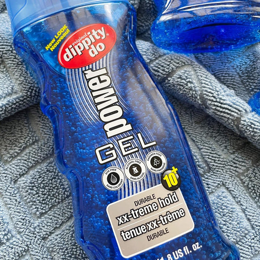 Dippity Do gel texture closeup on finger highlighting smooth spreadable consistency