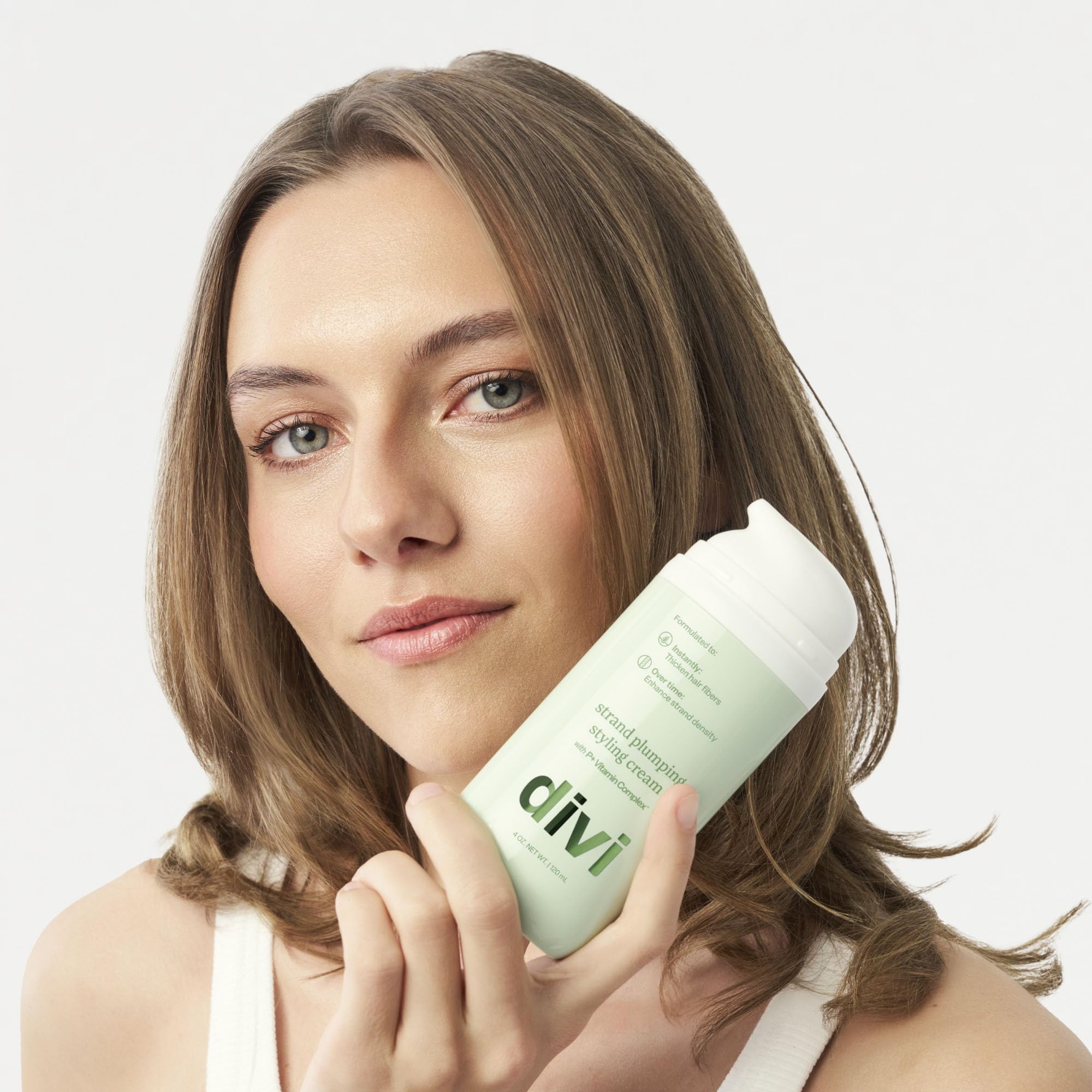 divi on bathroom counter styled scene promoting daily styling routine