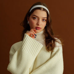 DiyJibb headband held in hand to show scale and lightweight travel-friendly benefit