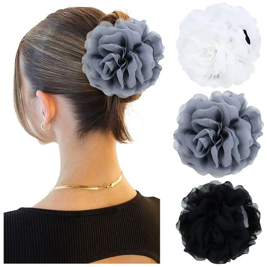 Dizila front view of three floral hair claws shows elegant styling benefit