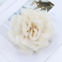 Dizila hair claws styled at a wedding setting showing romantic accessory appeal