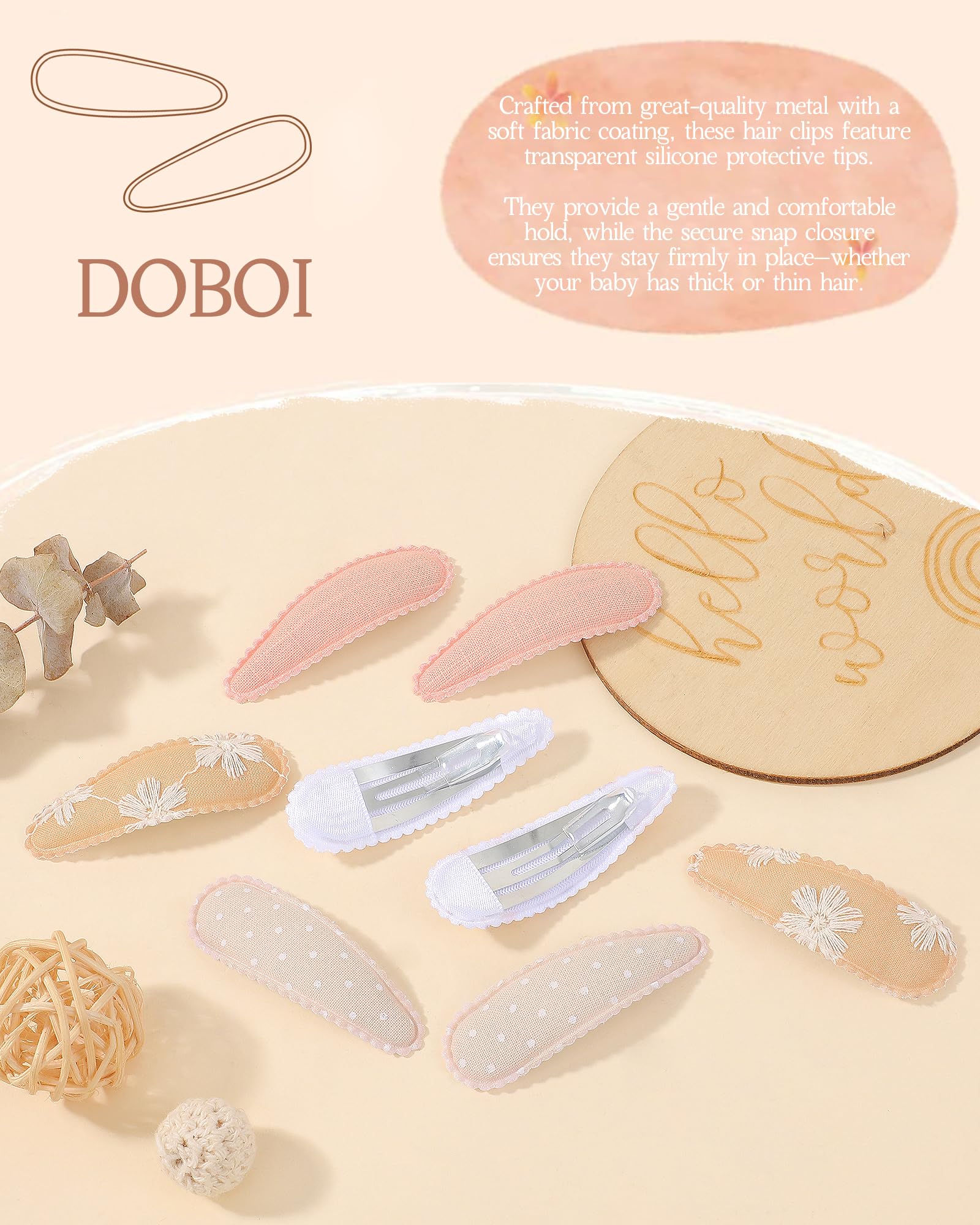 doboi close-up of fabric-wrapped snap clip highlighting soft texture and gentle hold