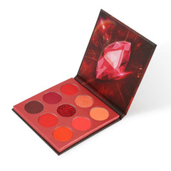 docolor front view of closed red gemstone palette showing compact travel-ready design and portability