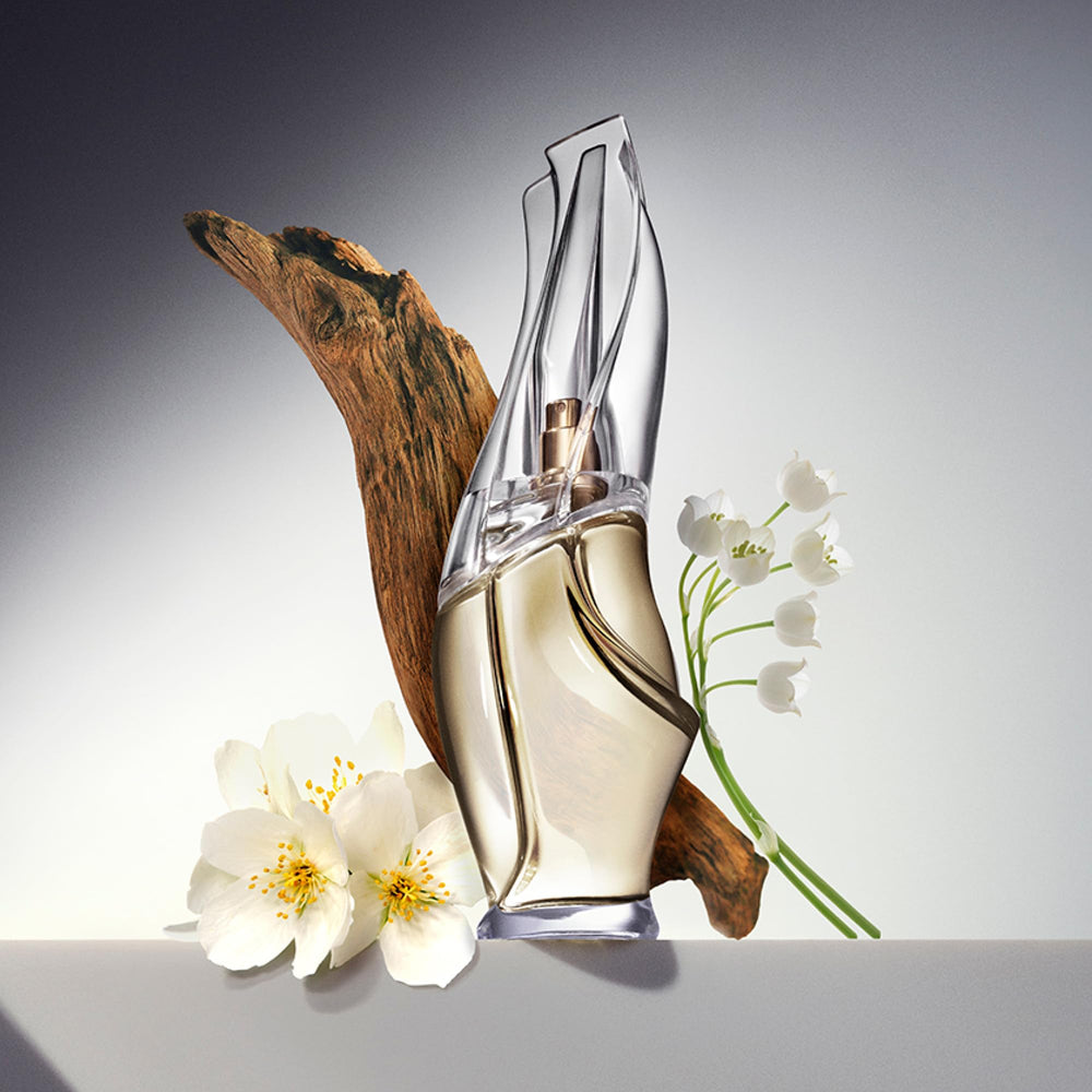 Donna Karan Cashmere Mist pump top close-up showing easy dispensing benefit