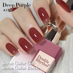 Double Rhythm bottle next to hand for scale, demonstrating compact 15ml travel-friendly size