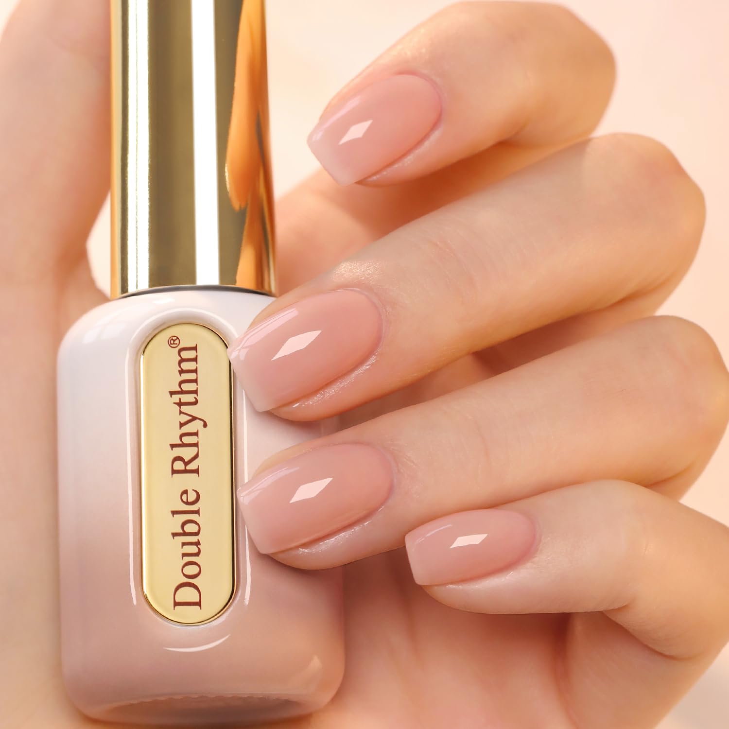 Double Rhythm front packaging showing nude pink bottle and gold cap, clear color preview for shoppers
