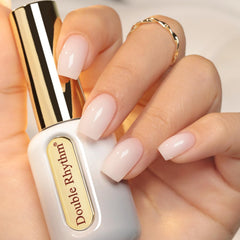 Double Rhythm milky white front packaging showing bottle and gold cap for premium presentation