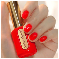 Double Rhythm neon red front bottle showing color and convenient gold cap