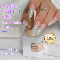 Hand holding 15ml Double Rhythm bottle to show compact, travel-friendly size