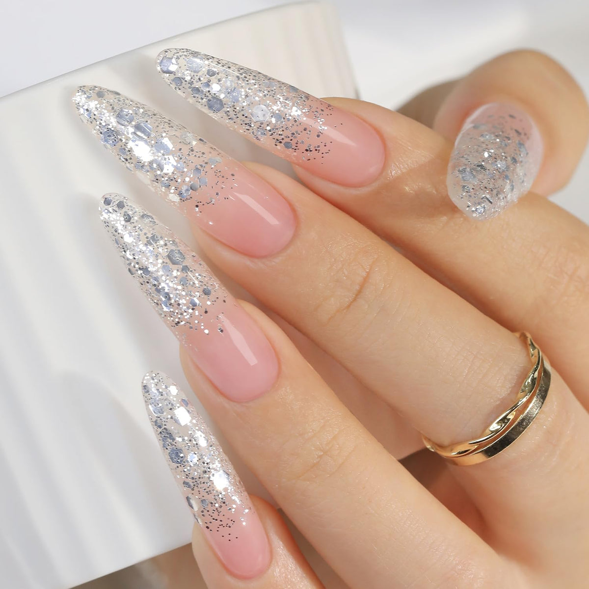 Double Rhythm bottle front view showing silver sequin polish and benefit of compact size