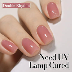 Double Rhythm swatch on nail wheel illustrating buildable pastel shades and layering results