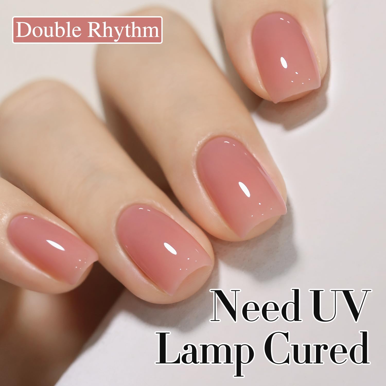 Double Rhythm swatch on nail tip illustrating milky nude color and layering options benefit