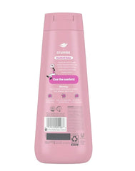 Pump dispensing Dove Confetti Cake body wash onto a loofah, brand softening benefit