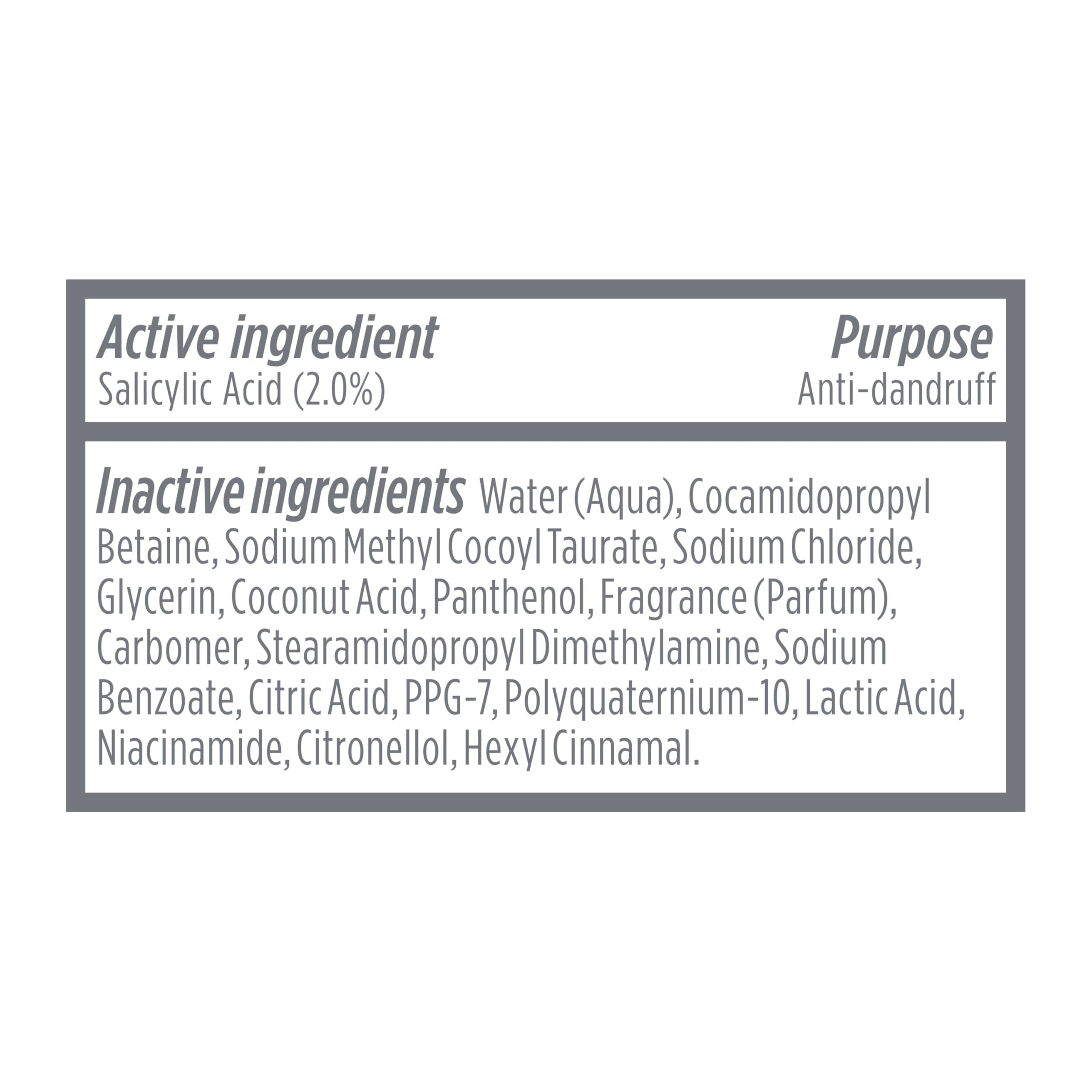 Dove Derma Scalp bottle on bathroom shelf among toiletries, suggesting routine use