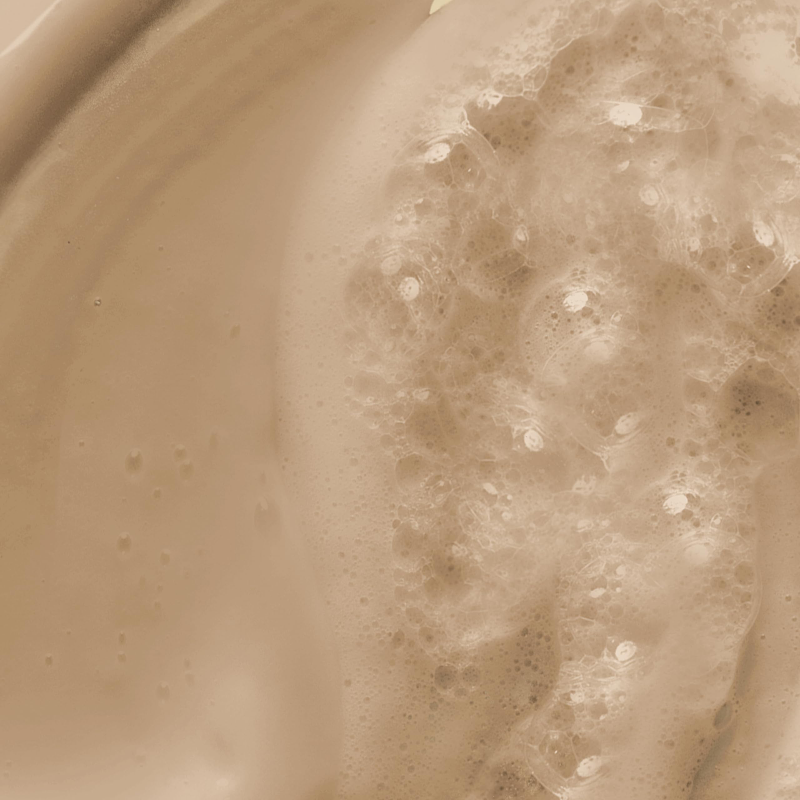 Dove body wash in use on arm, shows nourishing lather benefit