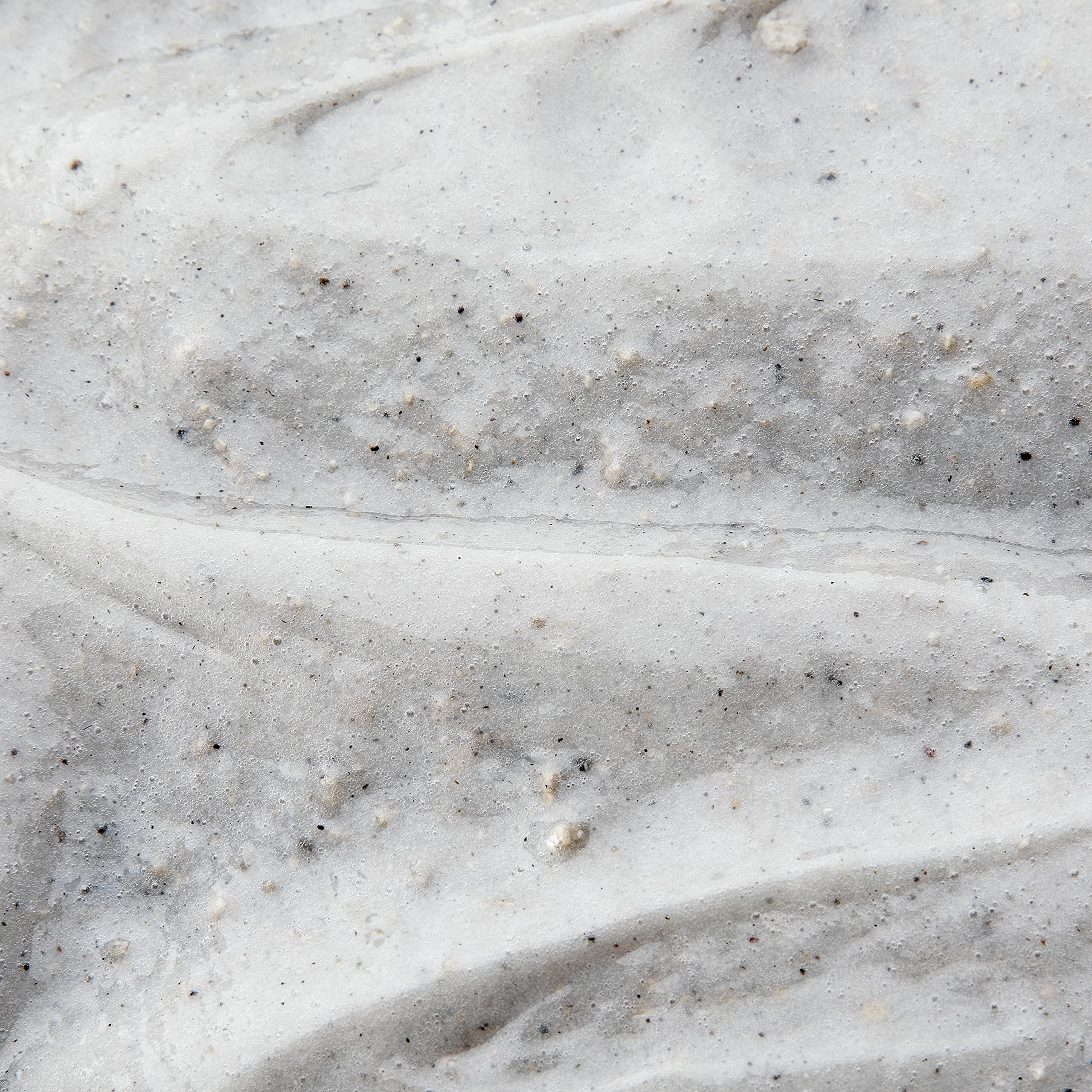 DOVE MEN + CARE charcoal and clay texture close-up demonstrating purifying action