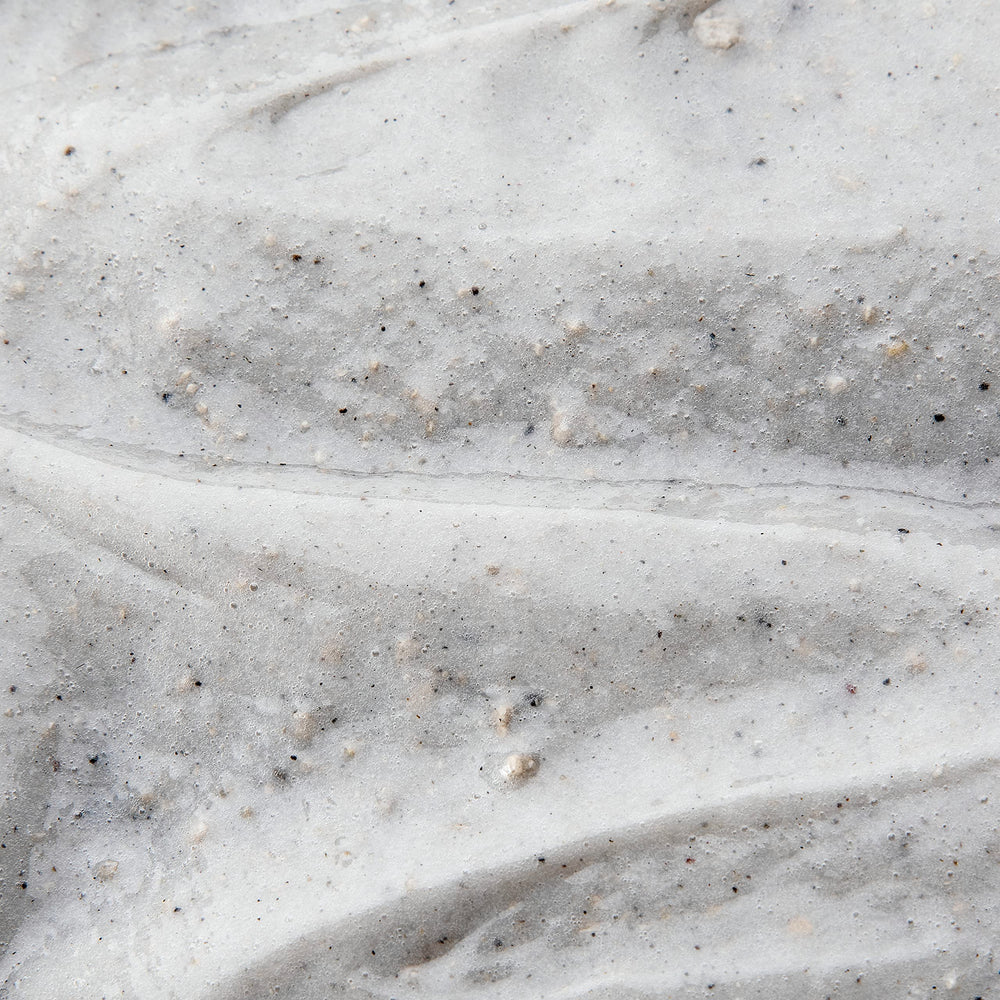 DOVE MEN + CARE charcoal and clay texture close-up demonstrating purifying action