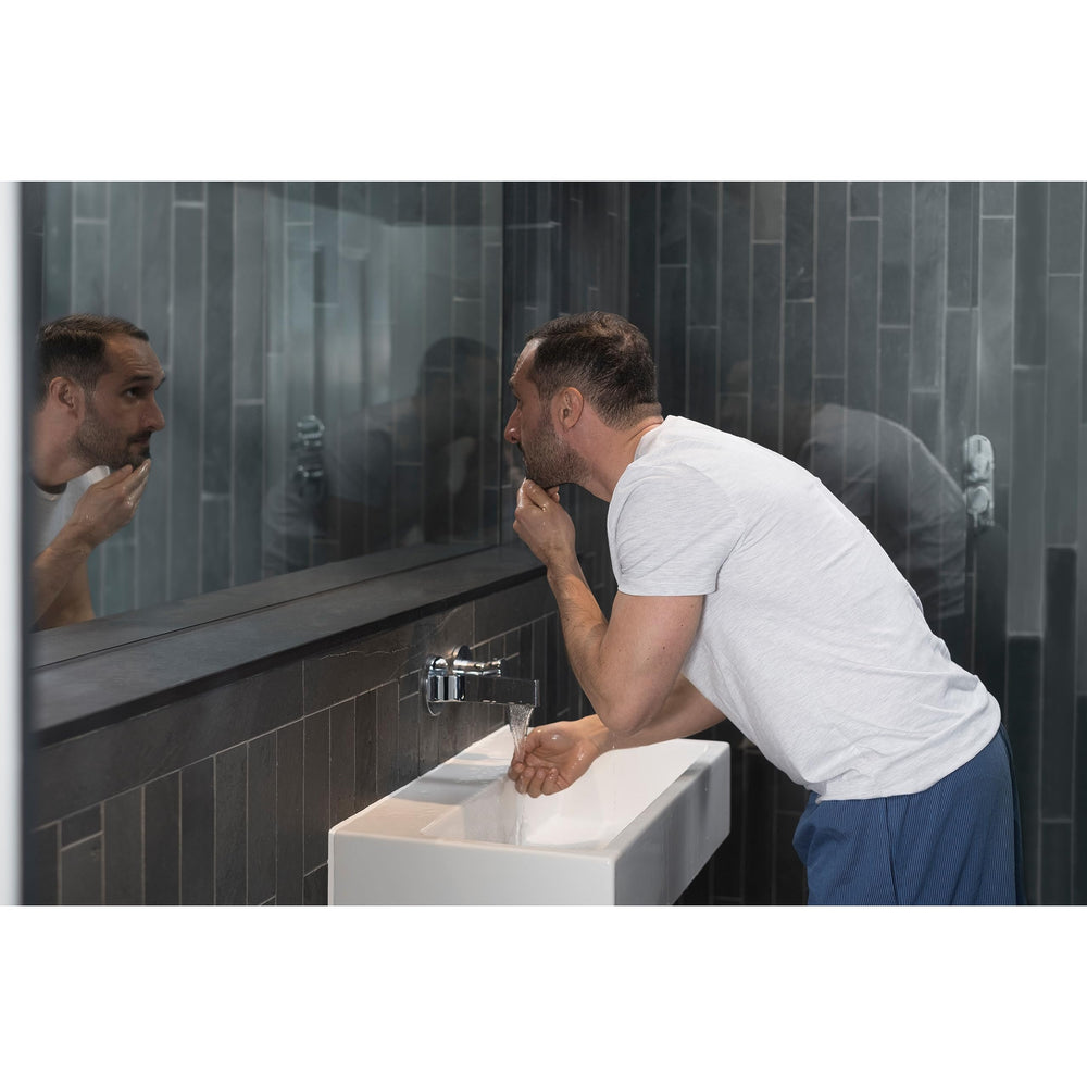 DOVE MEN + CARE bottle being used in shower showing easy rinse