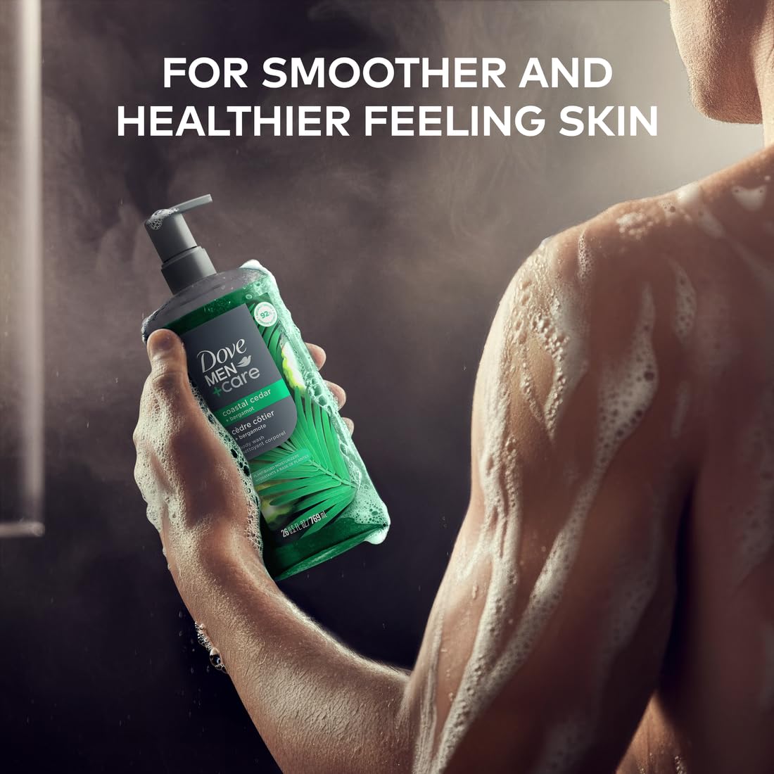 Dove Men+Care 26oz bottle in hand showing large-size value benefit
