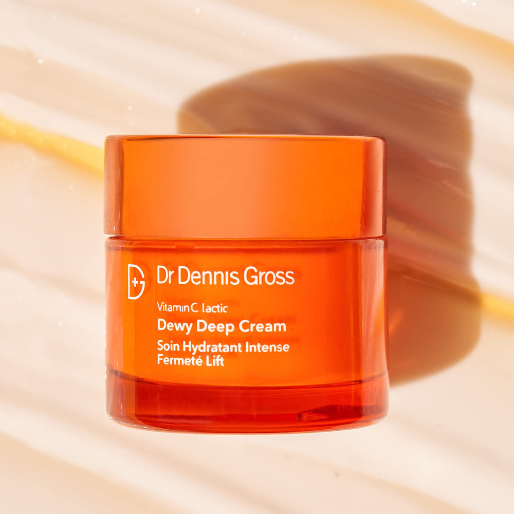 Dr Dennis Gross jar in lifestyle setting showing dewy skin result and radiant finish