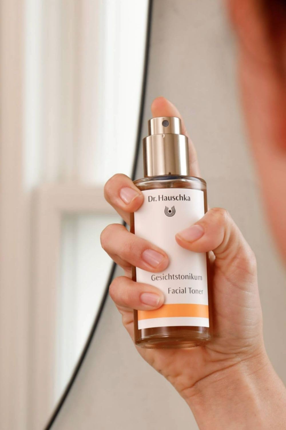 Dr. Hauschka toner texture on hand illustrating lightweight absorption