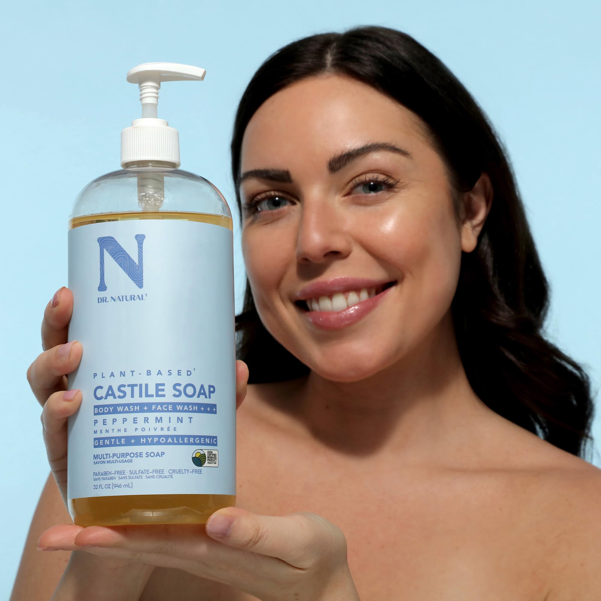 Dr. Natural bottle in shower scene demonstrating multi-use cleansing benefit