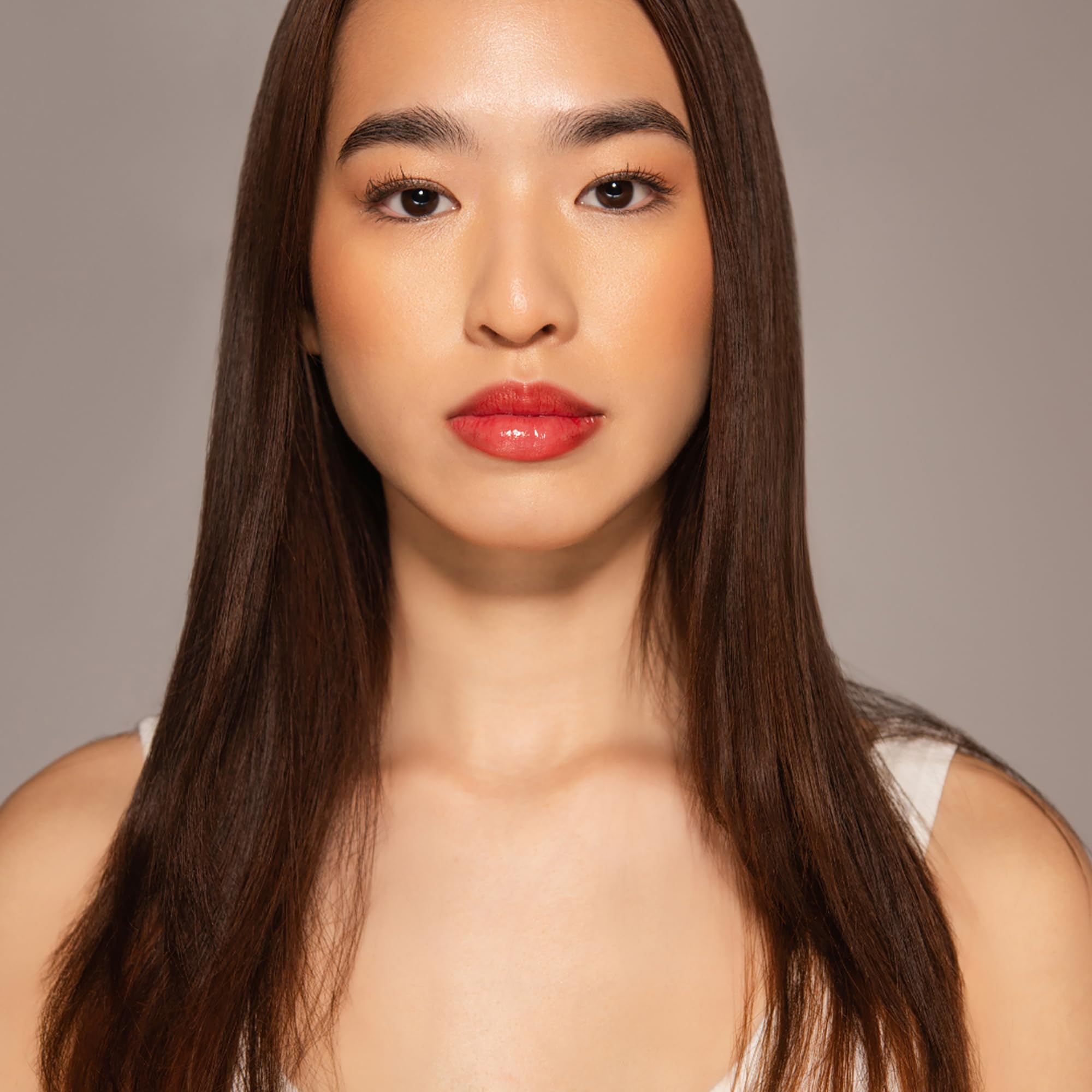 Dr. PAWPAW ORIGINAL BALM applied on lips demonstrating moisturized, natural-red finish